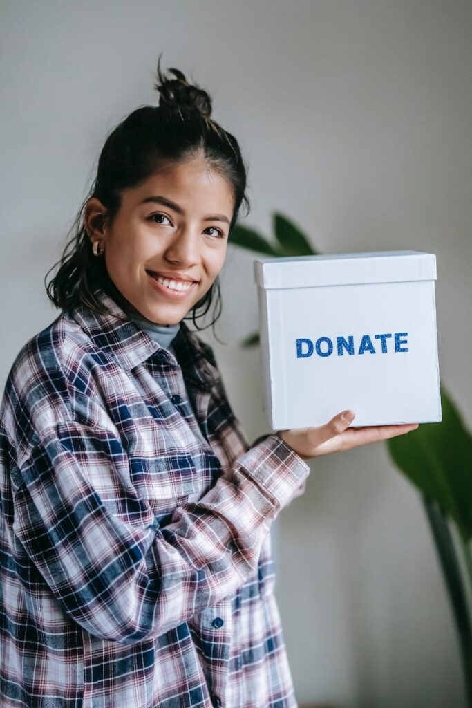 cheerful woman with donation box